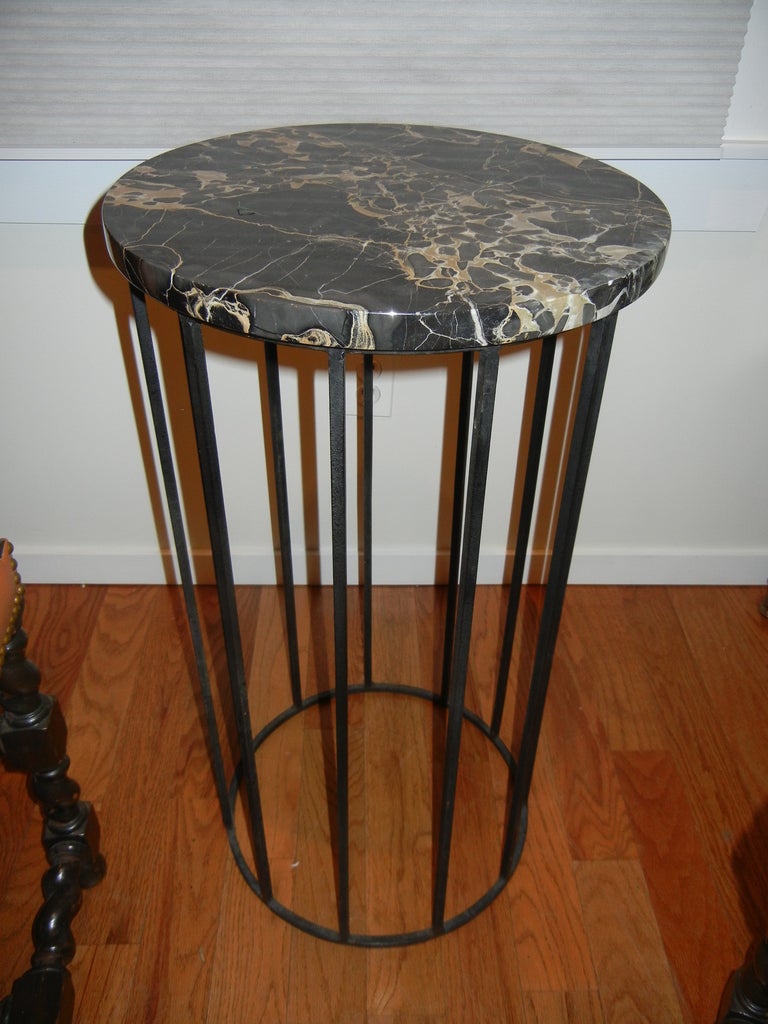 An English iron and marble table/stand. Very versatile, could be used to hold plants, bronzes or lighting. Can be considered Industrial.